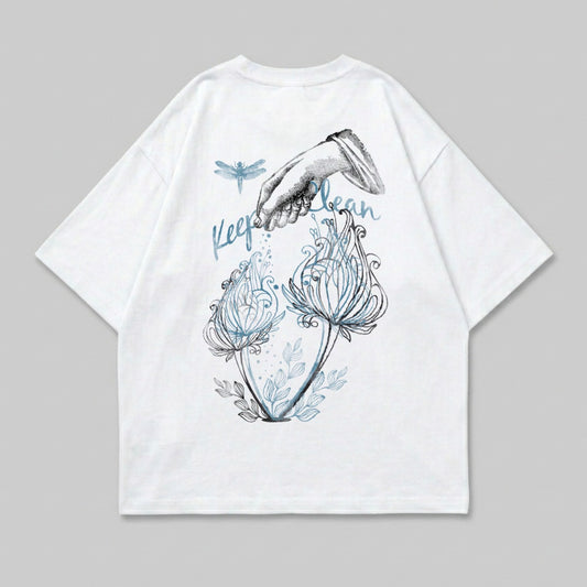 White t-shirt with dragonfly and hand watering plants graphic.