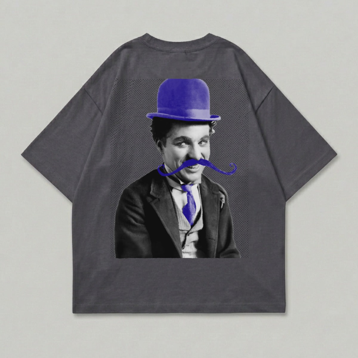 Charlie Chaplin wearing a bowler hat and bowtie, printed on a grey t-shirt.
