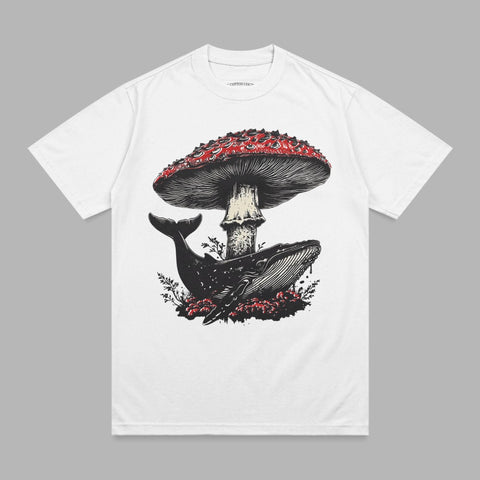 White t-shirt with graphic of whale under a mushroom and foliage.