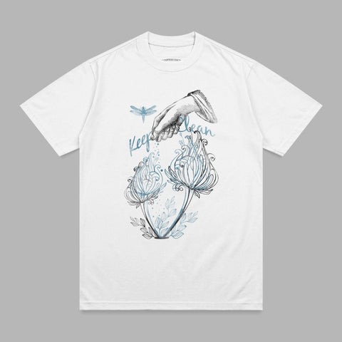 White t-shirt with blue dragonfly and floral illustration, text reads "Keep it clean".