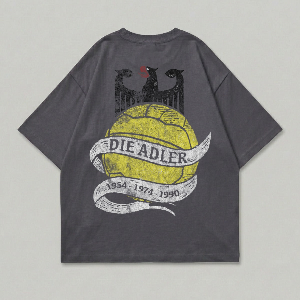 Grey t-shirt with yellow "DIE ADLER" text on a distressed ribbon over a black eagle graphic.