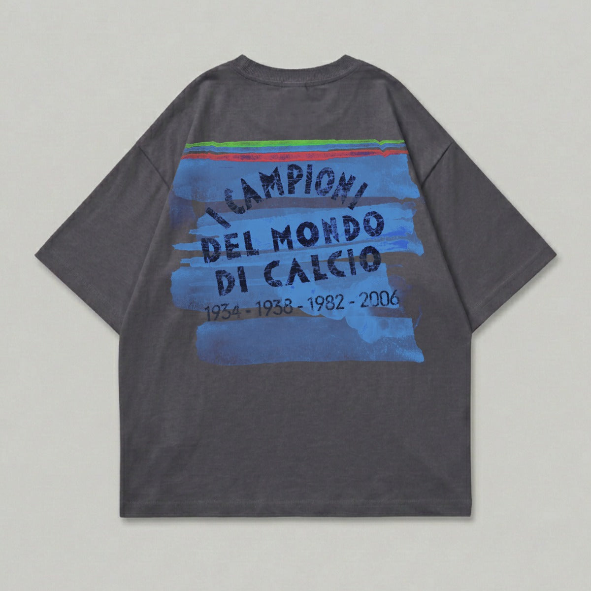 Dark grey t-shirt with blue brushstroke graphic and text "Campioni del Mondo di Calcio".