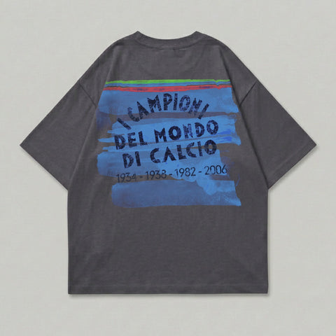Dark grey t-shirt with blue brushstroke graphic and text "Campioni del Mondo di Calcio".