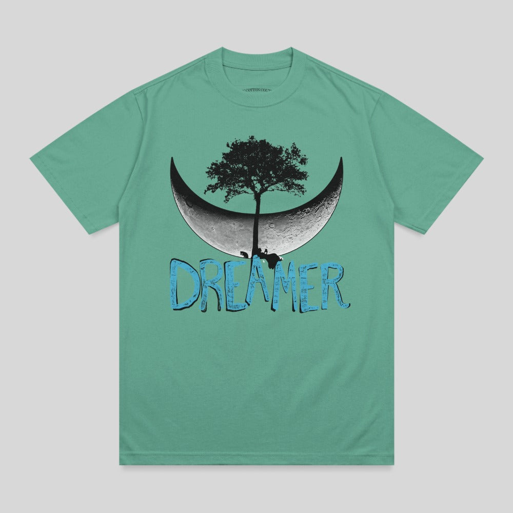 Teal t-shirt with a crescent moon, tree, and "DREAMER" text.