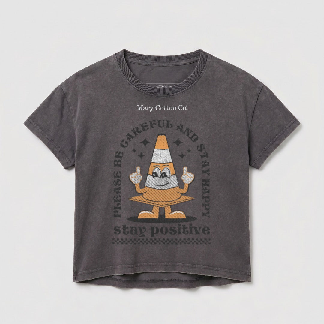 Dark grey t-shirt with traffic cone graphic and "STAY POSITIVE" text.