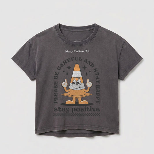 Dark grey t-shirt with traffic cone graphic and "STAY POSITIVE" text.