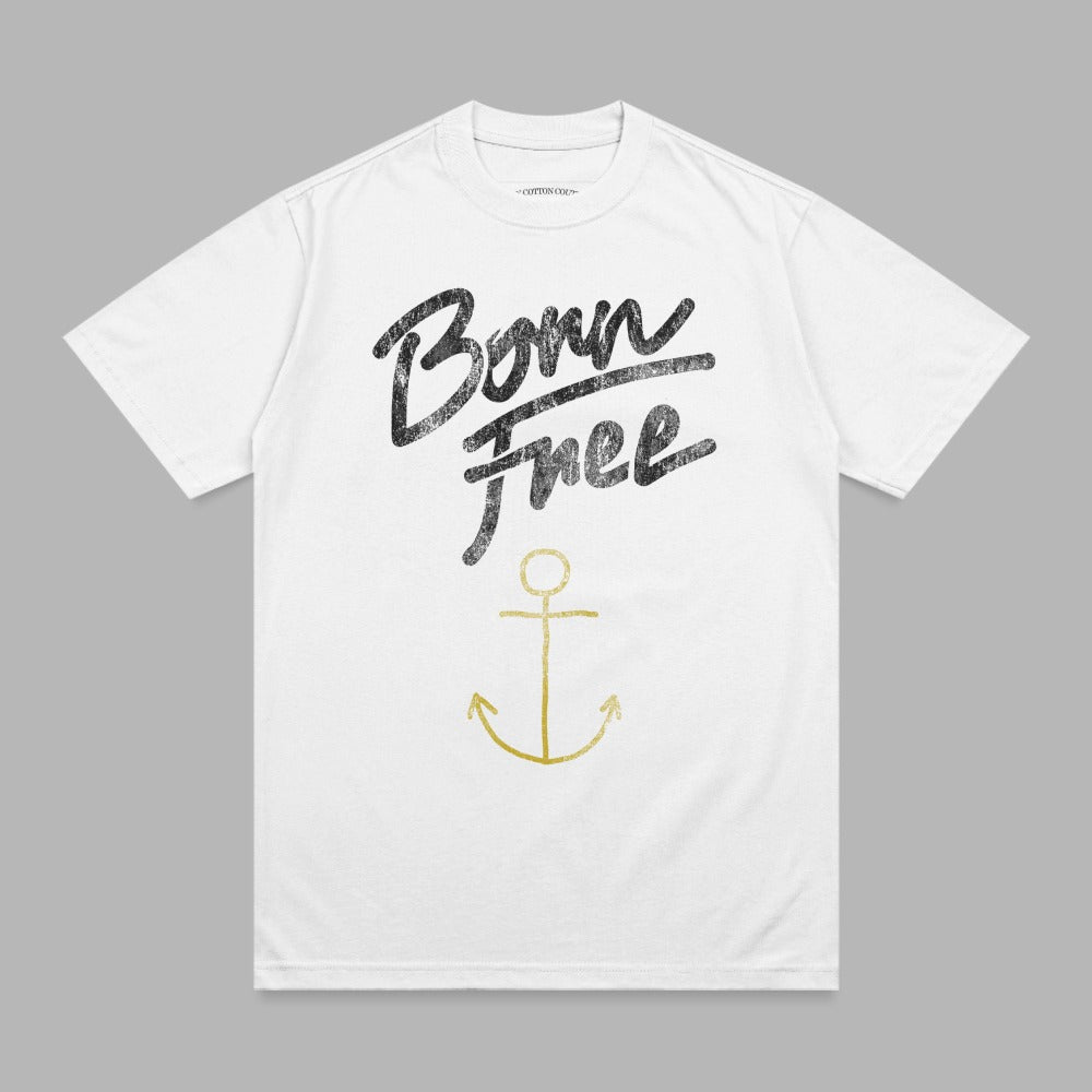 White t-shirt with "Born Free" in black script and a gold anchor.