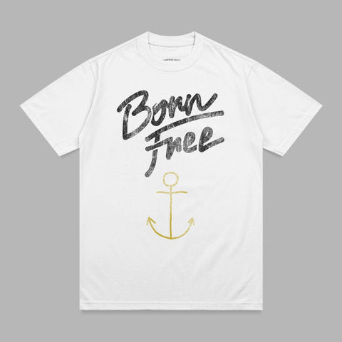 White t-shirt with "Born Free" in black script and a gold anchor.