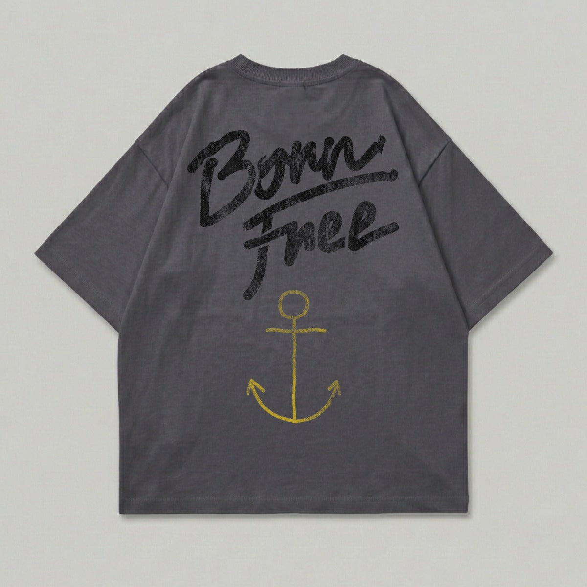 Dark grey t-shirt with yellow "Born Free" text and anchor graphic.