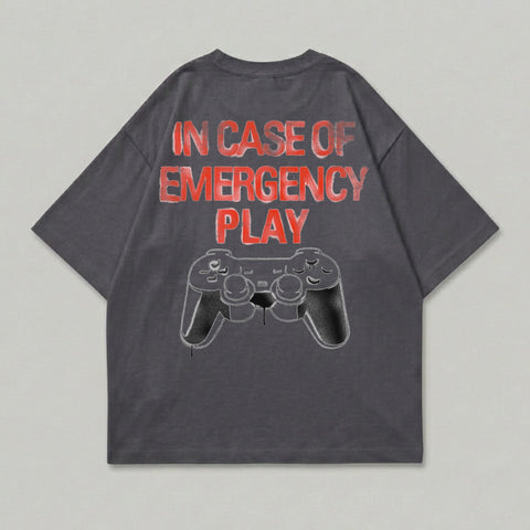 Dark grey t-shirt with "In Case of Emergency Play" and a video game controller graphic.
