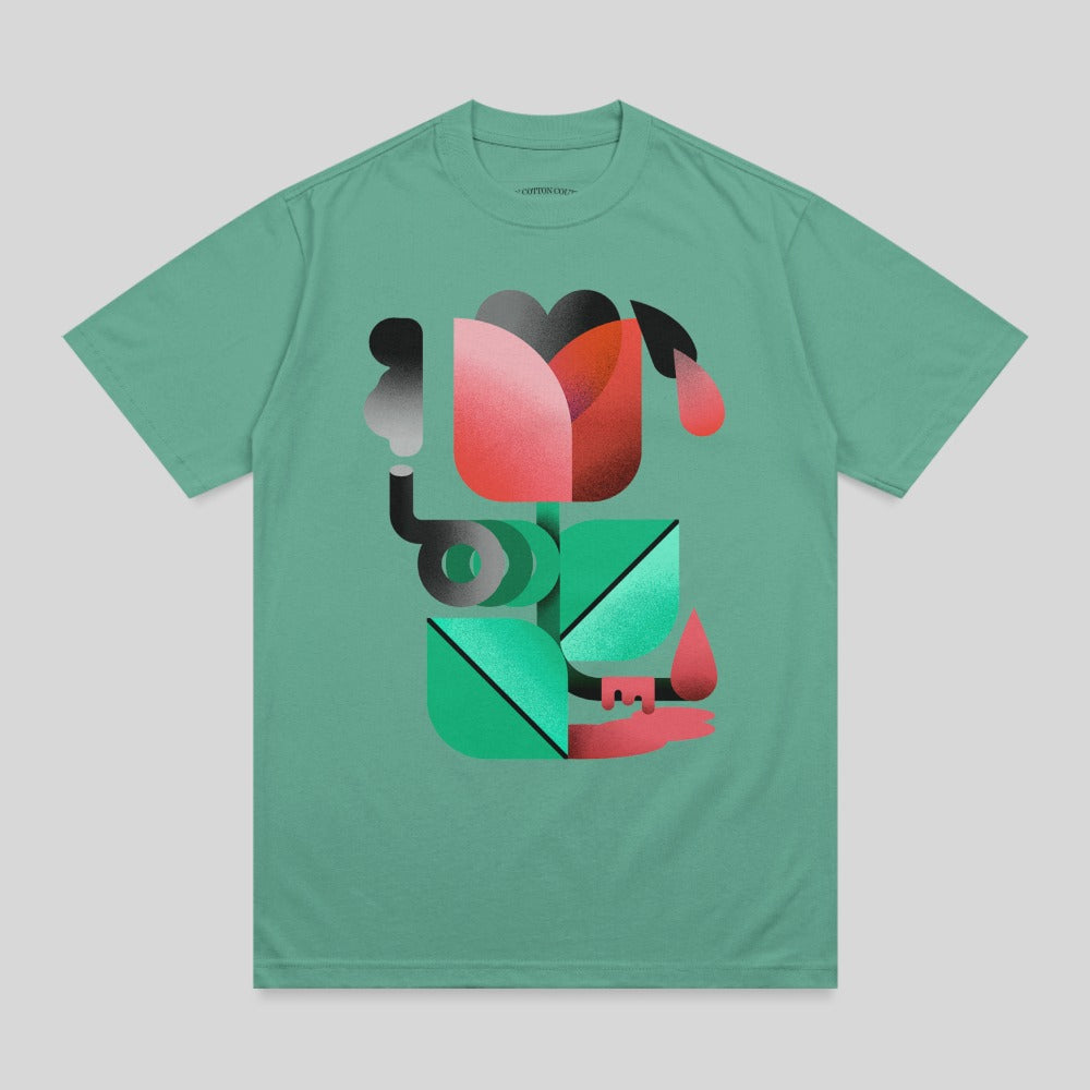 Green t-shirt with abstract geometric red and pink flower design.