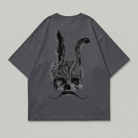 Dark grey t-shirt with a skull and rabbit ears graphic and mustache.