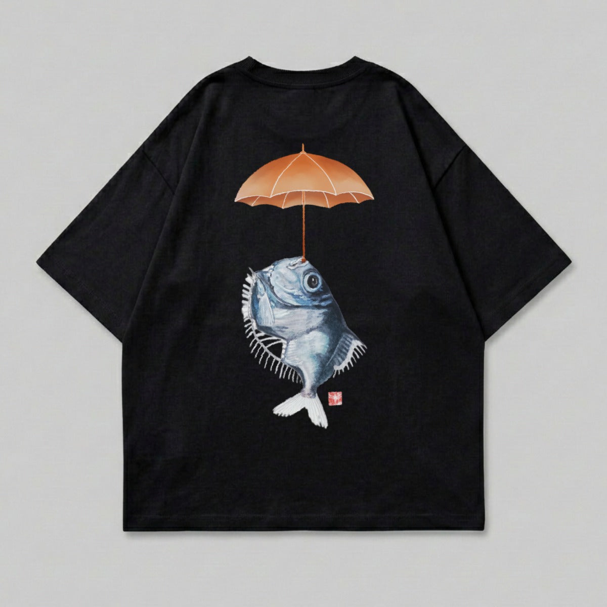 Black t-shirt with a detailed illustration of a fish holding an umbrella.