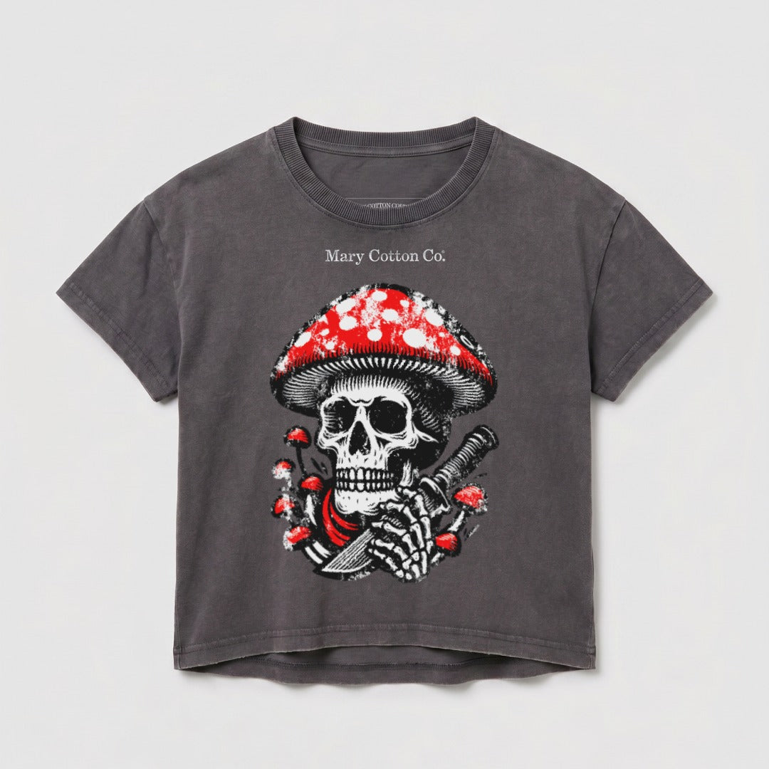 Dark grey t-shirt with a skull and mushroom graphic, holding a knife.