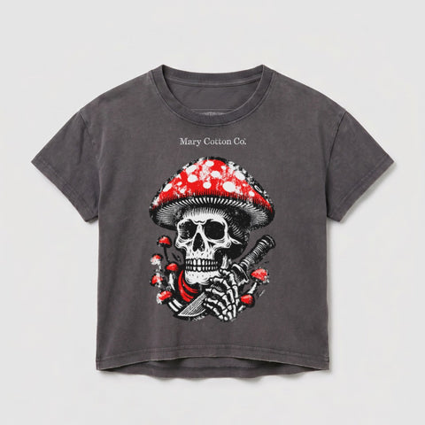 Dark grey t-shirt with a skull and mushroom graphic, holding a knife.