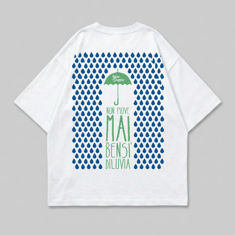 White t-shirt with blue raindrops and Italian text for "Never Rains".
