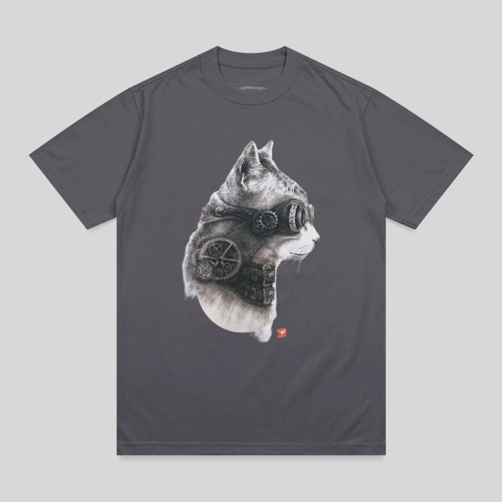 Steampunk cat illustration with goggles and gears on a charcoal gray t-shirt.