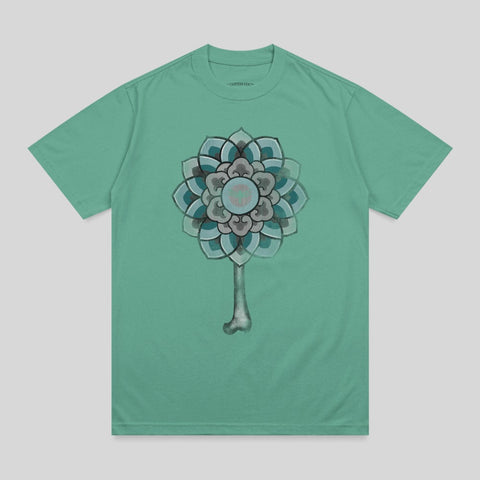 Teal t-shirt with a mandala design featuring a bone stem.