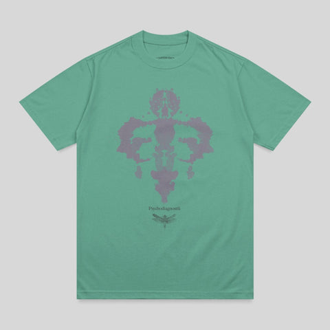 Green t-shirt with a Rorschach-style ink blot design and dragonfly.