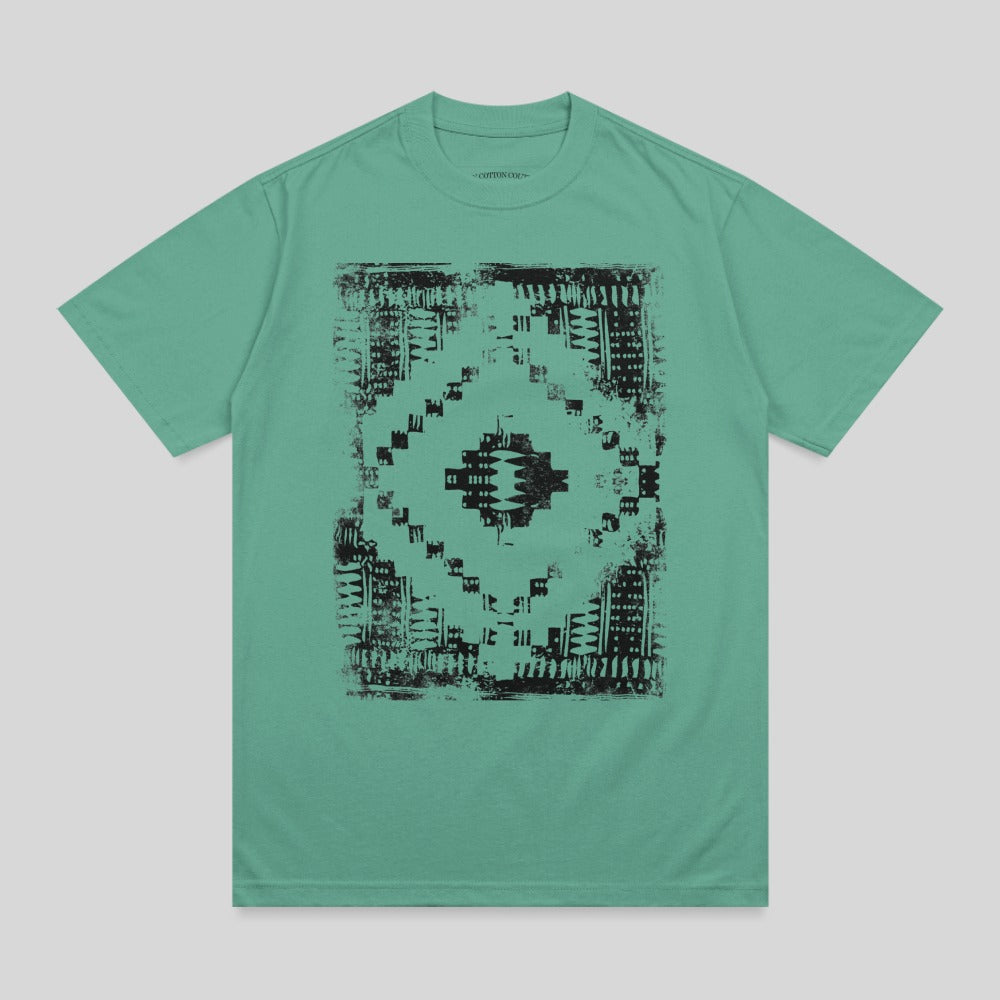 Teal t-shirt with black geometric tribal pattern on chest.