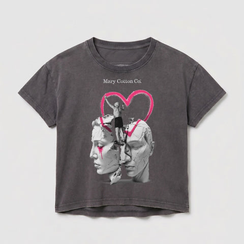 Gray t-shirt with abstract graphic of fractured faces, a figure, and a heart.
