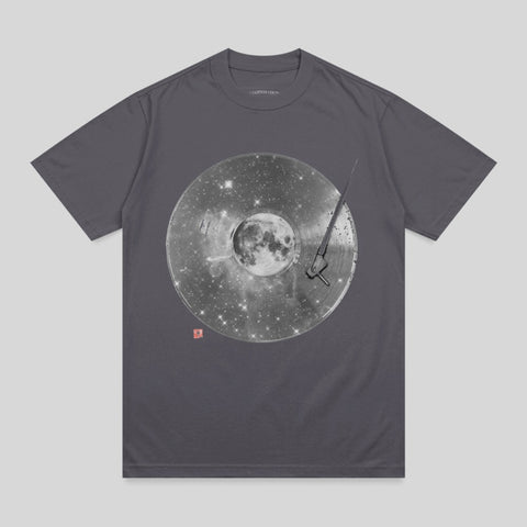 T-shirt with graphic of moon and stars on a record.