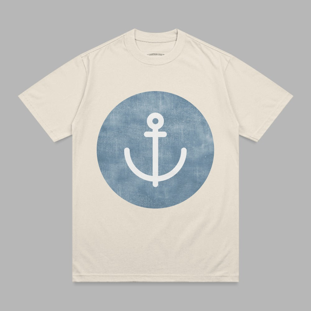 Cream t-shirt with blue anchor graphic on chest.