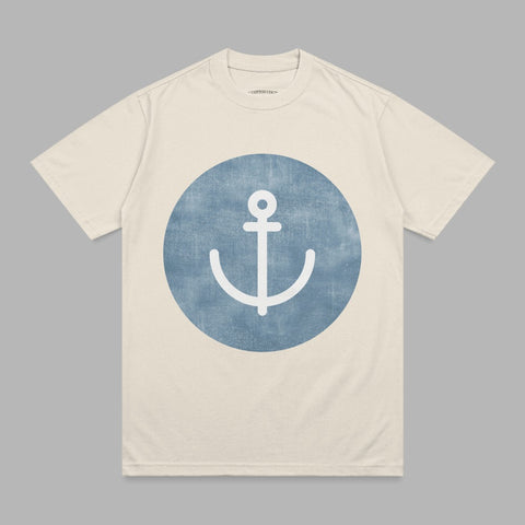 Cream t-shirt with blue anchor graphic on chest.
