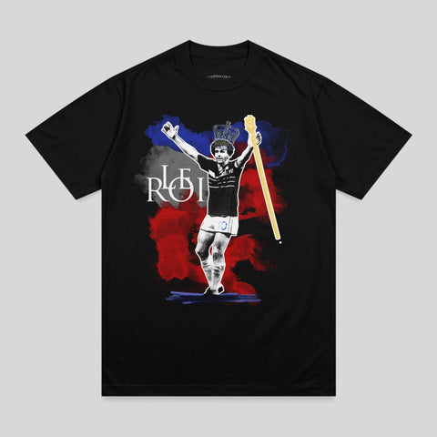 Black t-shirt with a watercolor painting of a soccer player holding a trophy.