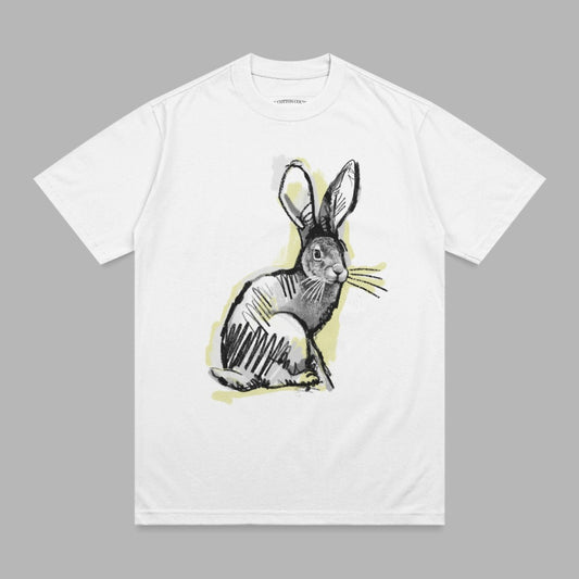 White t-shirt with a sketch of a rabbit wearing a yellow halo.