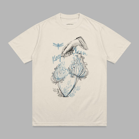 Cream t-shirt with a "Keep Clean" graphic featuring a hand pouring water on flowers and a dragonfly.