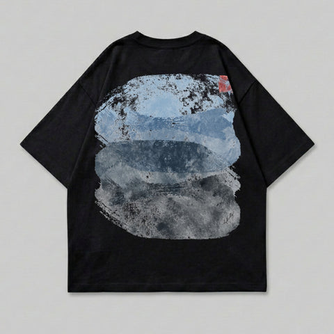 Black t-shirt with abstract blue and gray brushstroke design on the back.