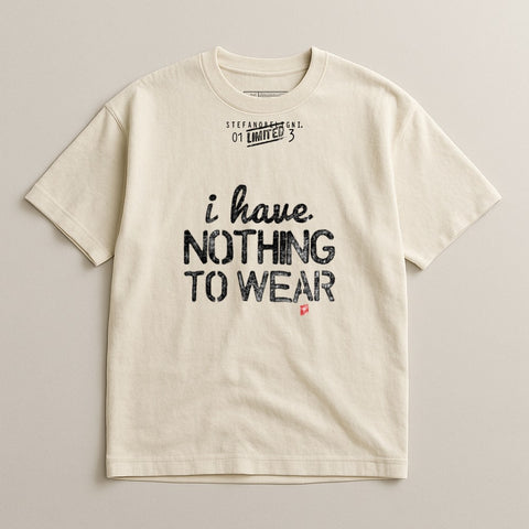 Cream t-shirt with "I have. Nothing to wear." text and "Stefano Benigni 01 LIMITED 3"