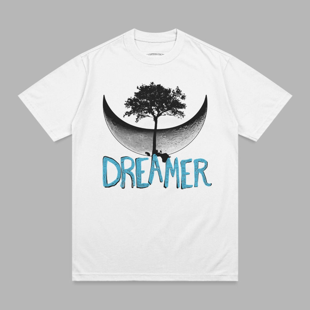 White t-shirt with a moon graphic and the word "DREAMER" in blue text.