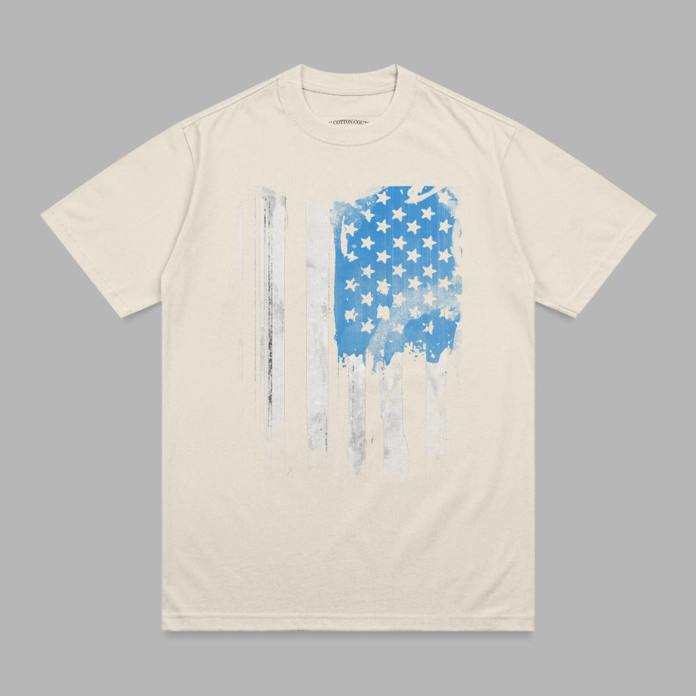 Cream t-shirt with distressed American flag graphic.