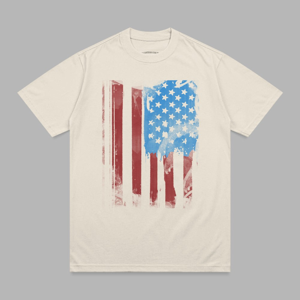 Cream t-shirt with distressed American flag graphic.