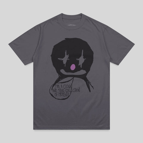Dark gray t-shirt with a black clown face graphic and text.