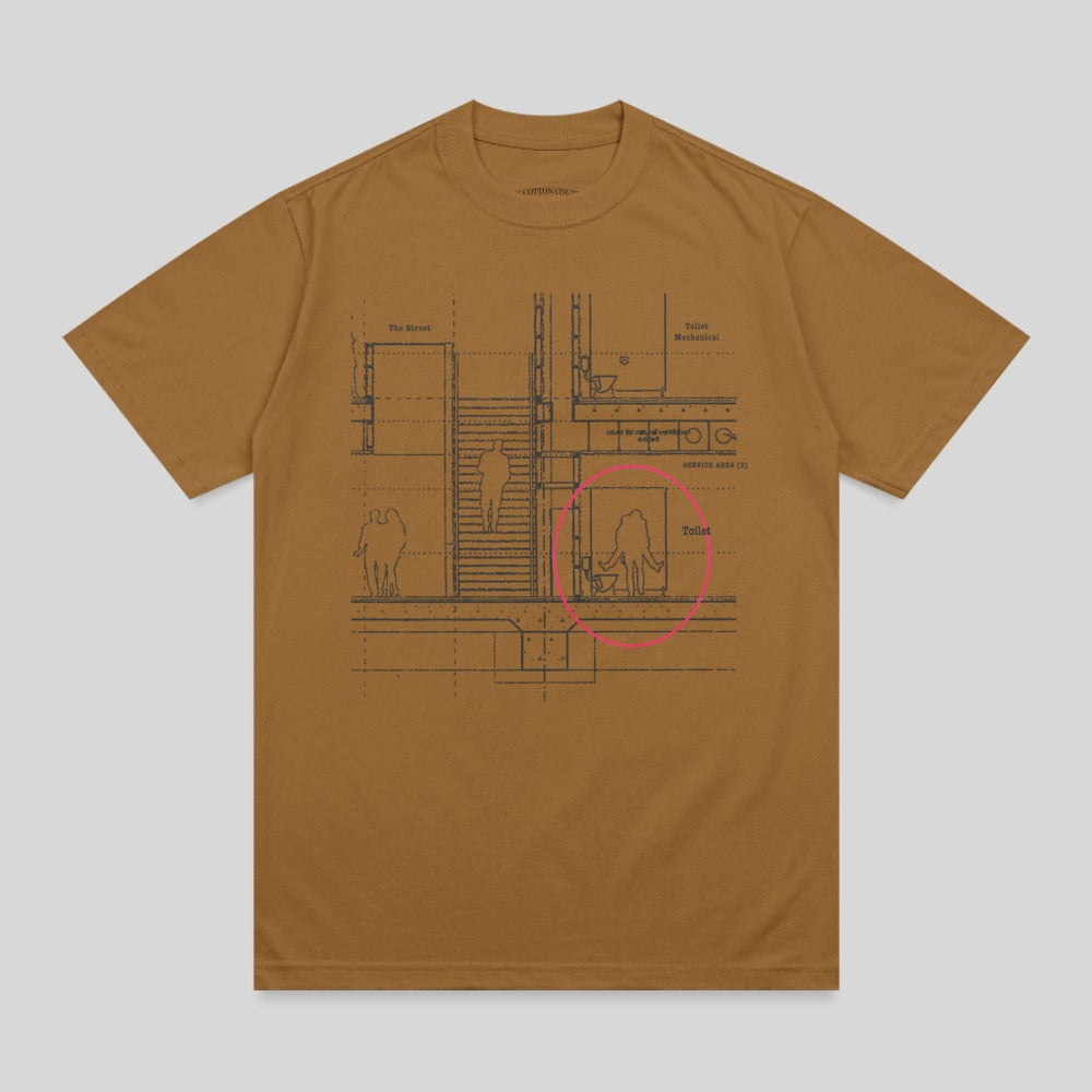 Brown t-shirt with architectural blueprint of a toilet area highlighted in pink.