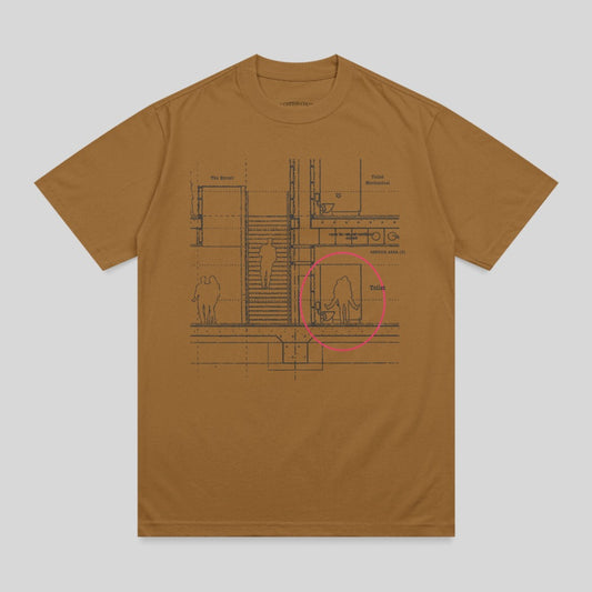 Brown t-shirt with architectural blueprint of a toilet area highlighted in pink.