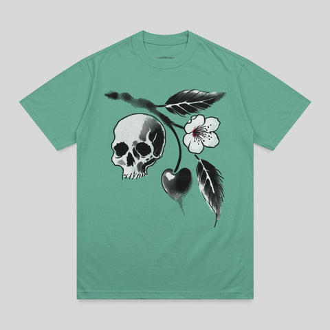 Teal t-shirt featuring a skull with cherry blossoms and leaves.