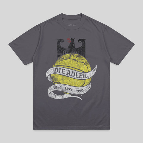 Grey t-shirt with yellow soccer ball, eagle, and text "DIE ADLER 1954-1974-1990".