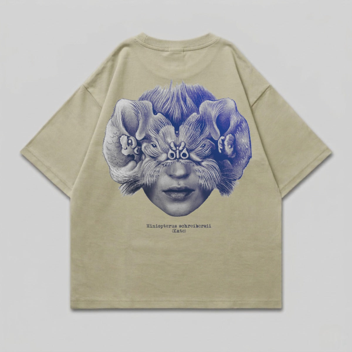 T-shirt with abstract graphic of a woman's face and winged creatures.