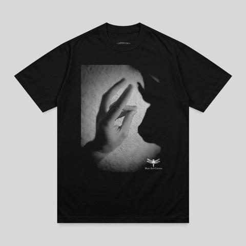 Black t-shirt with shadow of a hand and "MARY JANE COTTON" logo.