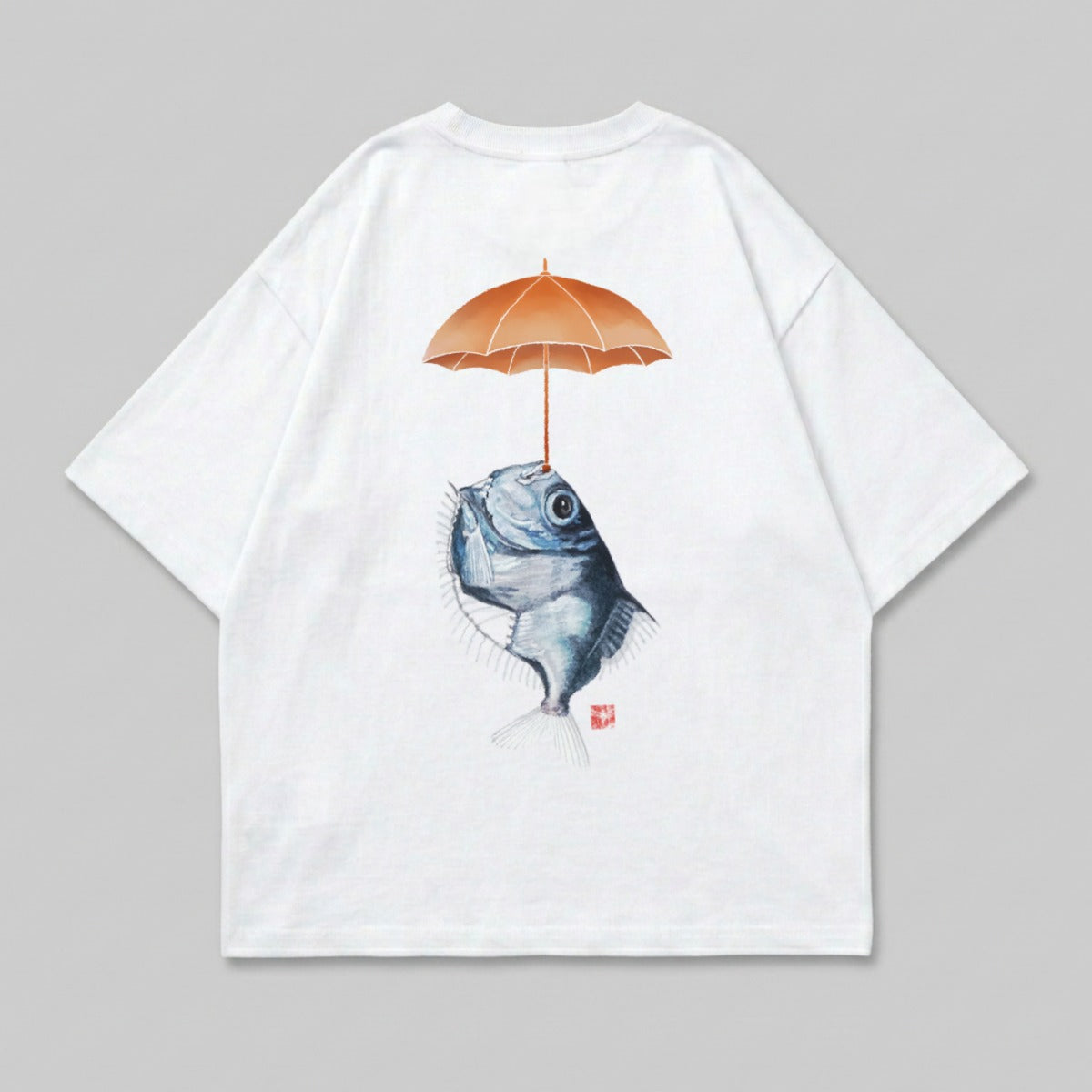 White t-shirt with illustration of fish holding an umbrella.