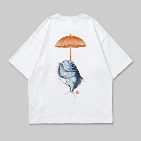 White t-shirt with illustration of fish holding an umbrella.