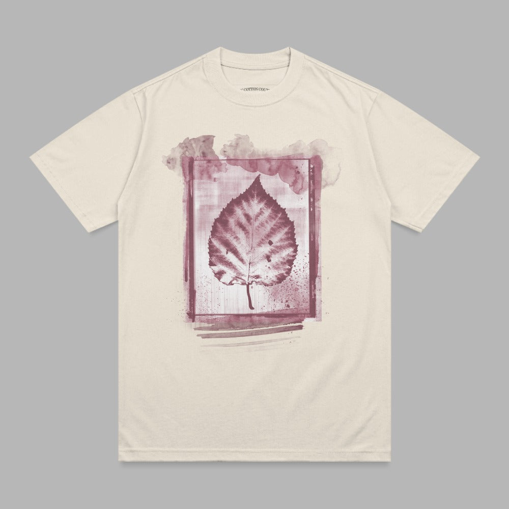 Cream t-shirt with a watercolor leaf graphic.