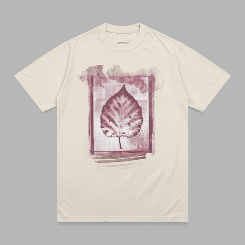 Cream t-shirt with a watercolor leaf graphic.