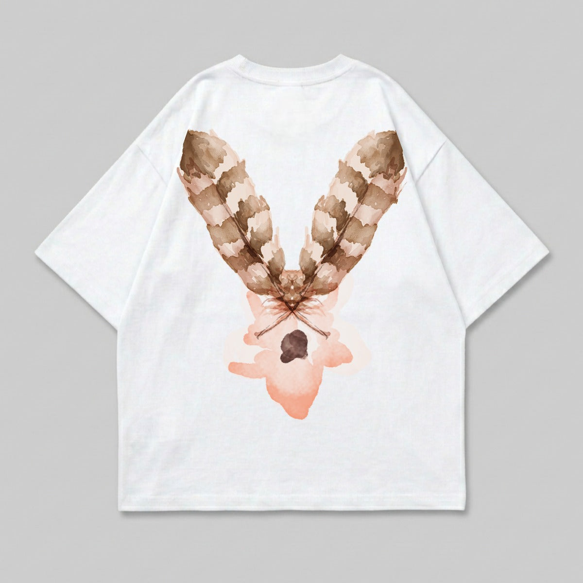 White t-shirt with a brown feather and pink floral design on the back.