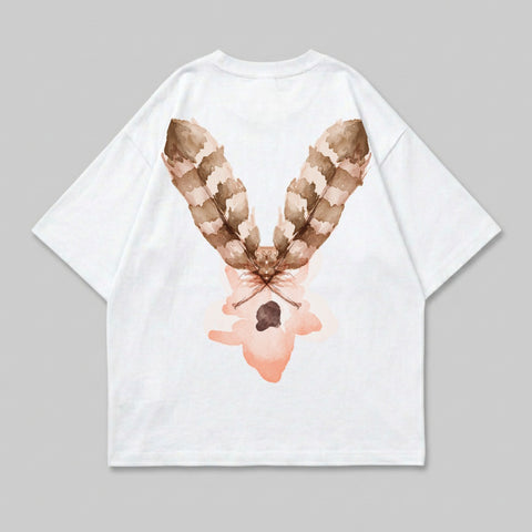 White t-shirt with a brown feather and pink floral design on the back.