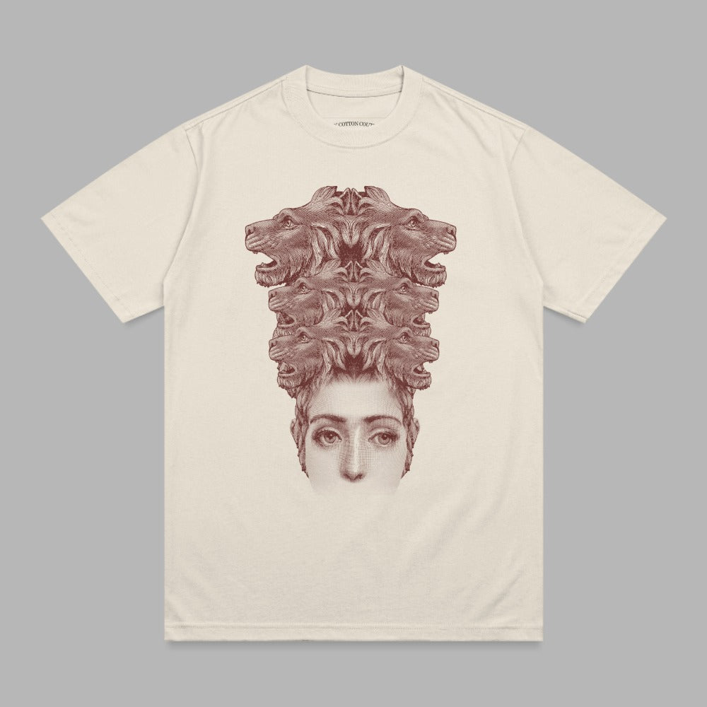 T-shirt with stylized human face topped by a cluster of lion heads.